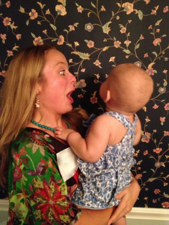 Monica entertaining Cousin C by trying to grab the flowers off the wallpaper (it's the small things).